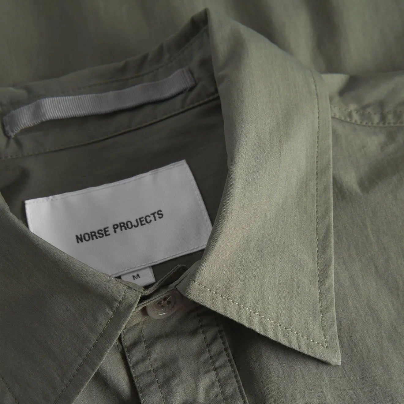 Norse Projects Ivan Tech Poplin SS Shirt Ivy Green decorative element